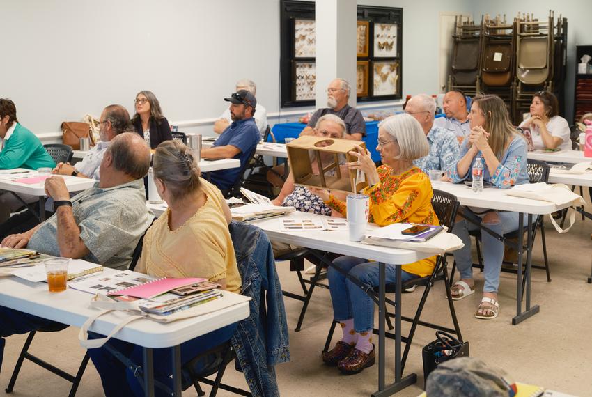 Students inspect a piece of beekeeping equipment during a âBee Keeping 101â class in San Antonio on Thursday, May 9, 2024